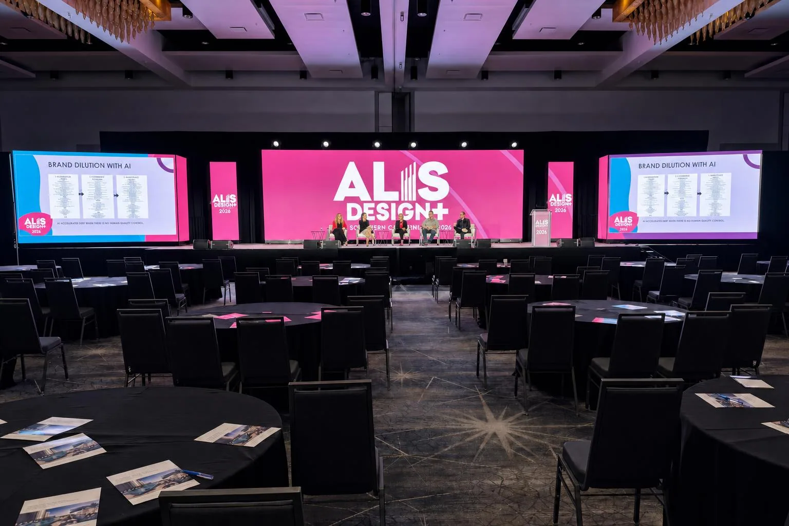 Corporate stage with LED wall, scenic design, and hybrid show lighting in Orange County