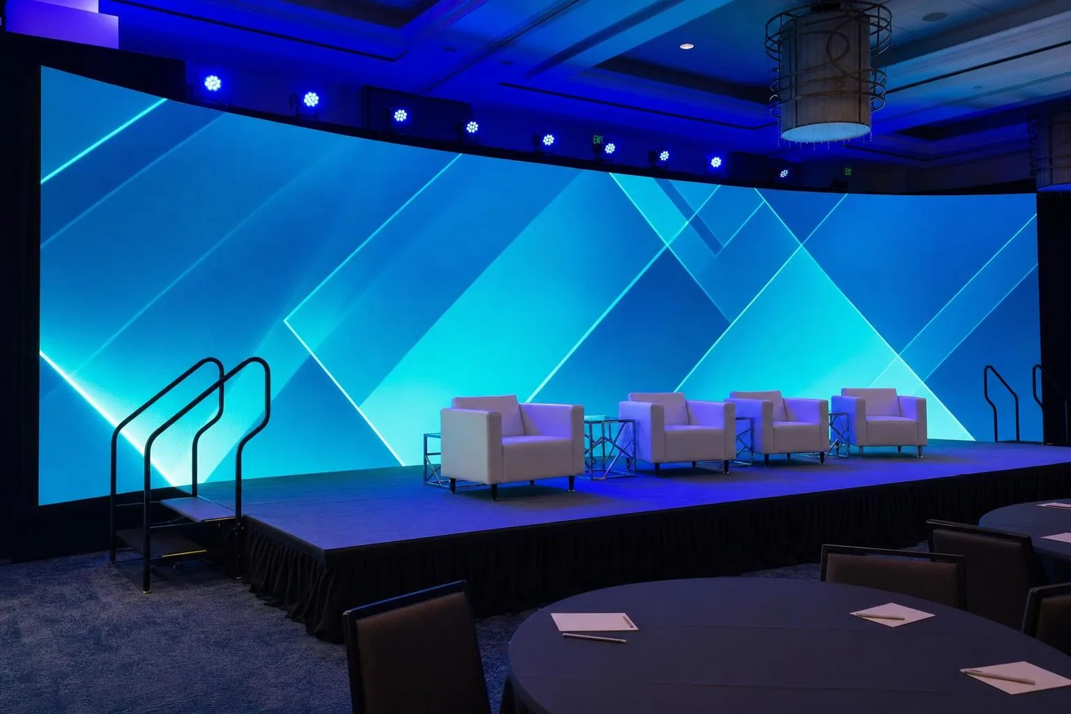 Mid-wide view of LED wall install and ballroom scale from the side aisle